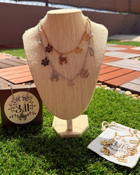 Legado - garita, flor de maga, isla, coqui y sol taino.
